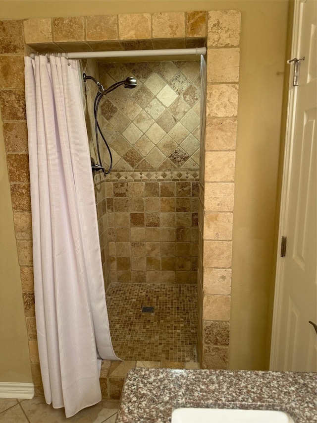 bathroom featuring tile patterned floors and a shower with curtain