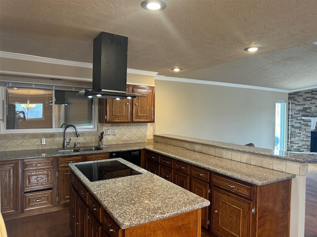 kitchen featuring dark wood-type flooring, black appliances, sink, island range hood, and kitchen peninsula