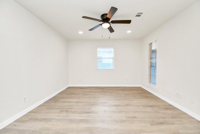 unfurnished room featuring ceiling fan and light hardwood / wood-style flooring