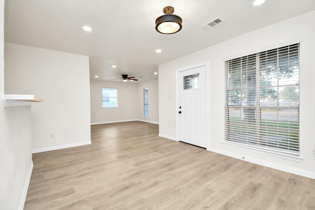 entryway with light wood-type flooring and ceiling fan