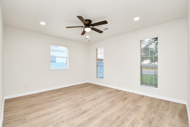 unfurnished room featuring light hardwood / wood-style flooring and ceiling fan