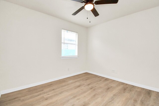 empty room featuring ceiling fan and light hardwood / wood-style floors