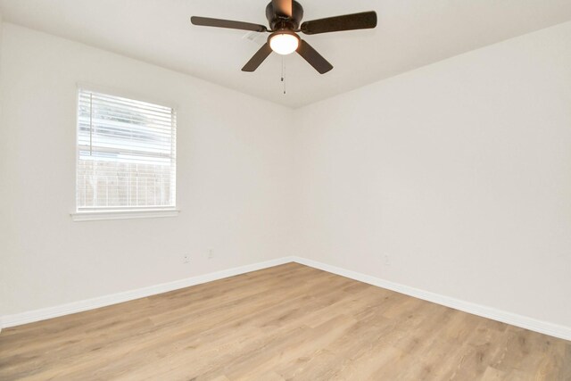 spare room with ceiling fan and light hardwood / wood-style floors