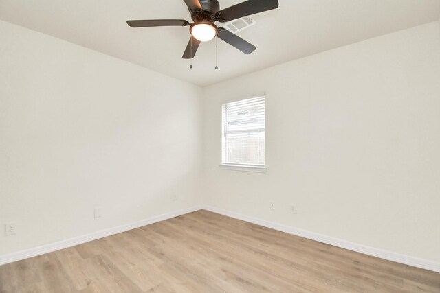 spare room featuring ceiling fan and light hardwood / wood-style flooring