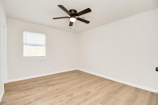 spare room featuring ceiling fan and light wood-type flooring