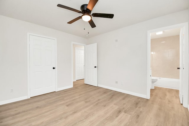 unfurnished bedroom featuring ceiling fan, light hardwood / wood-style floors, and connected bathroom