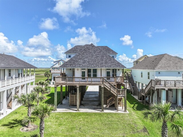 back of house featuring a yard and a deck