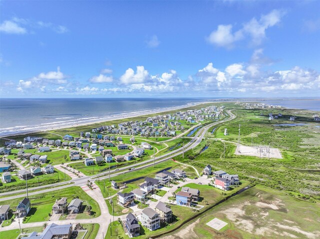 aerial view featuring a water view and a view of the beach