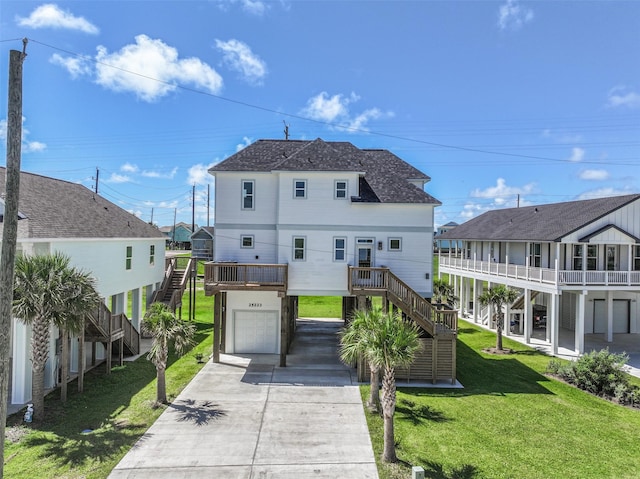 rear view of property featuring a lawn and a carport