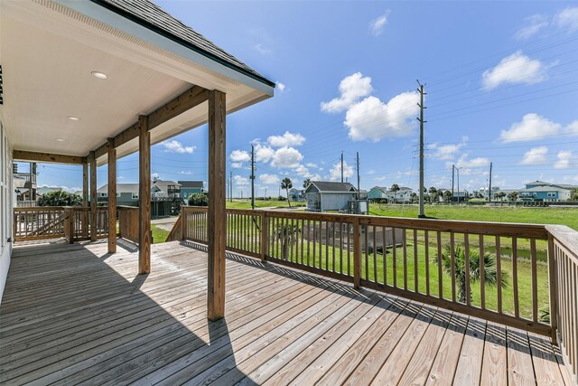 deck featuring a lawn