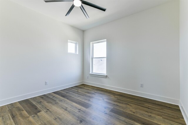 empty room featuring ceiling fan and dark wood-type flooring