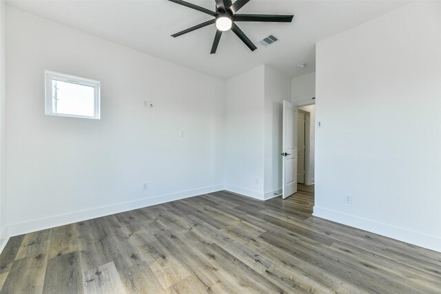 spare room featuring ceiling fan and hardwood / wood-style flooring