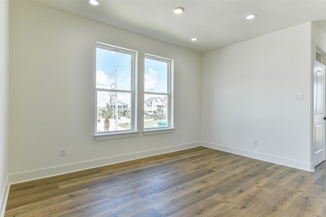 spare room featuring dark wood-type flooring