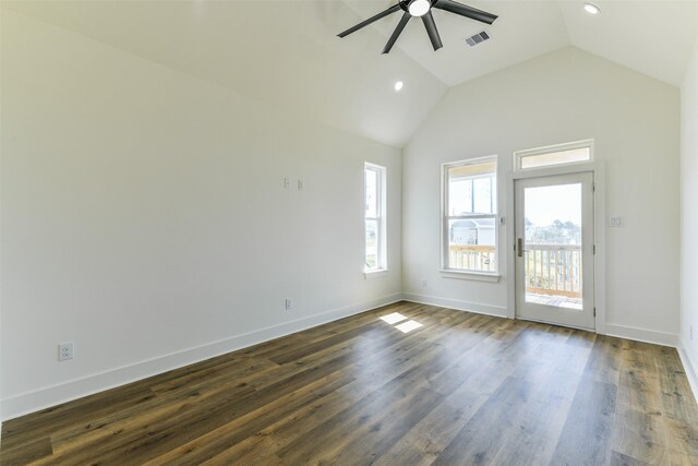 empty room featuring ceiling fan, dark wood-type flooring, and vaulted ceiling