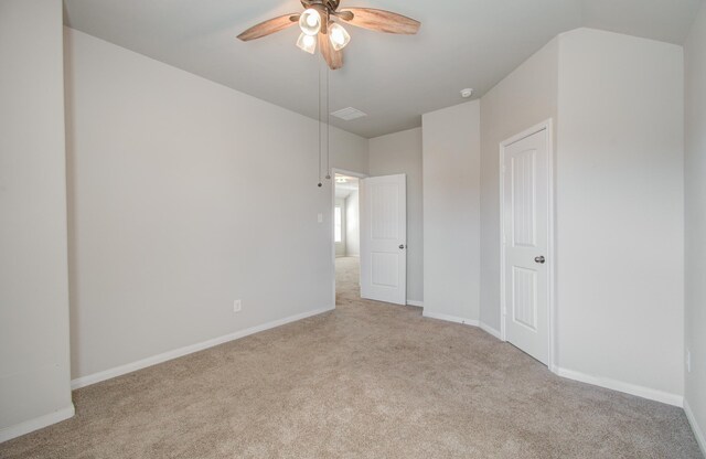 unfurnished room featuring ceiling fan and light colored carpet