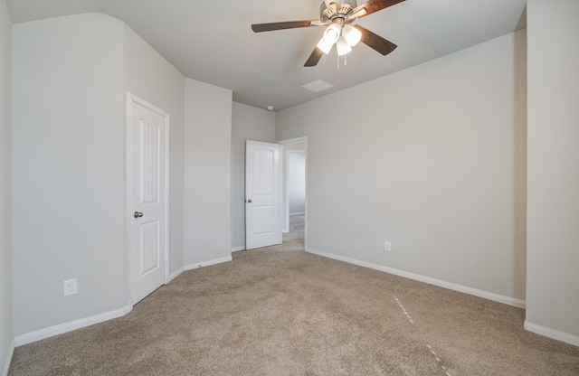 unfurnished room featuring ceiling fan and light carpet