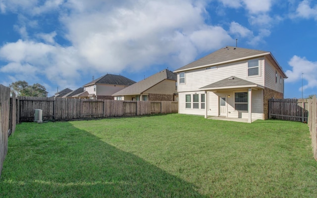 rear view of house with a lawn