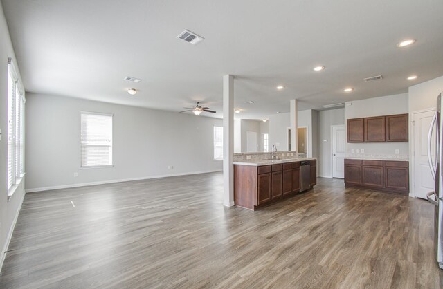 kitchen with ceiling fan, sink, wood-type flooring, and stainless steel dishwasher