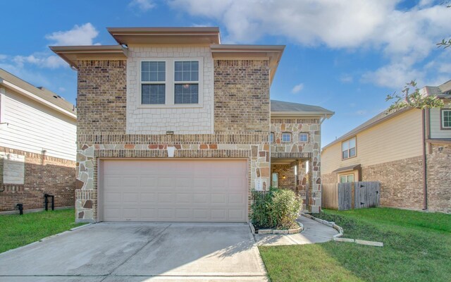 front of property featuring a garage and a front lawn