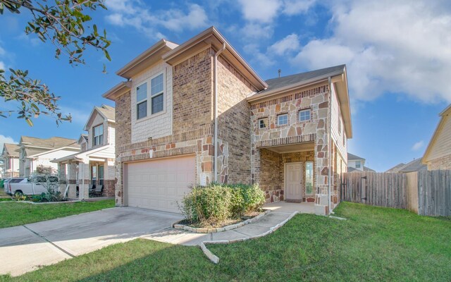 view of front of house with a garage and a front lawn