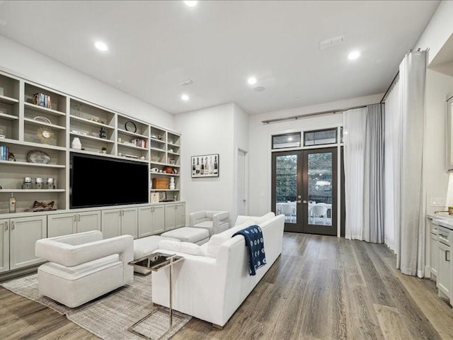 living room featuring french doors and wood-type flooring