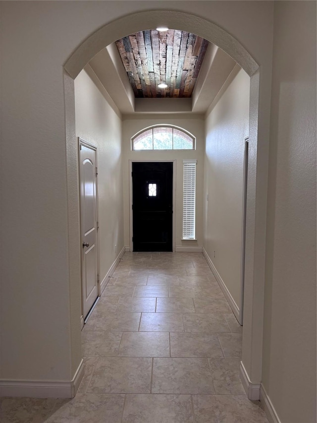 foyer with a tray ceiling