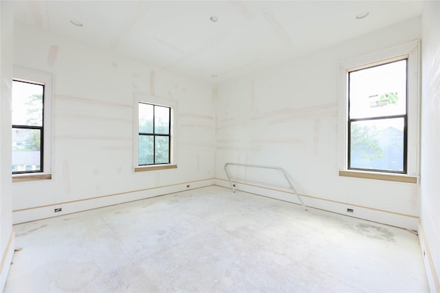 1439 Martin St, Houston, TX 77018 - empty room with plenty of natural light and unfinished concrete floors