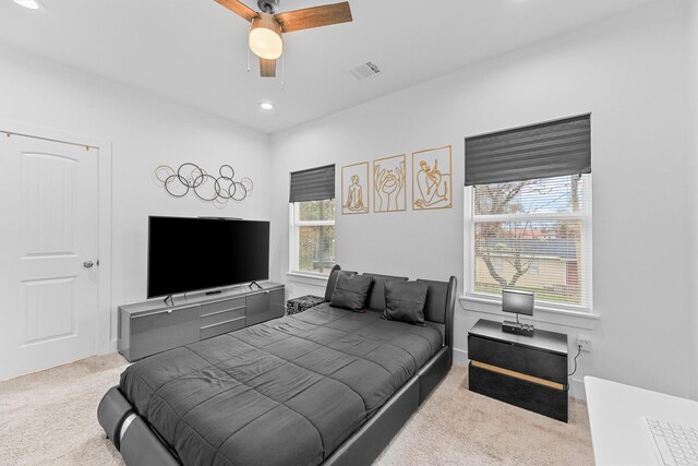 carpeted bedroom featuring ceiling fan