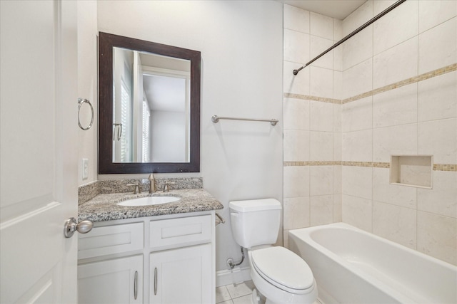 full bathroom with toilet, tile patterned floors, tiled shower / bath, and vanity