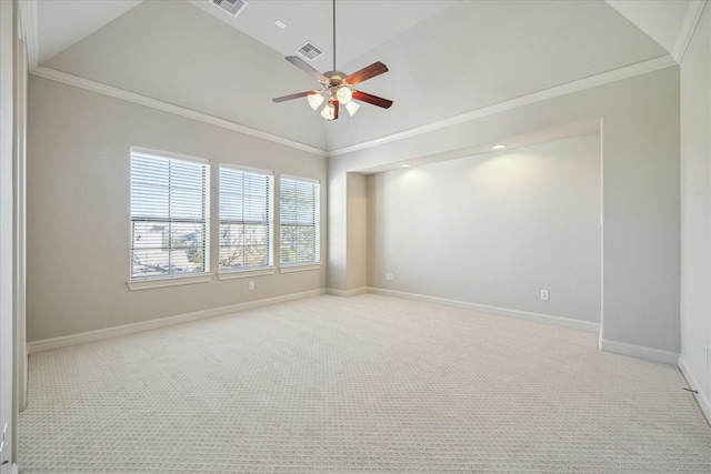 carpeted spare room with vaulted ceiling, ceiling fan, and ornamental molding