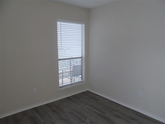 empty room featuring dark hardwood / wood-style floors