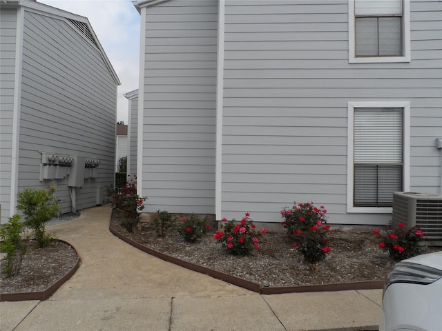 view of property exterior featuring central AC