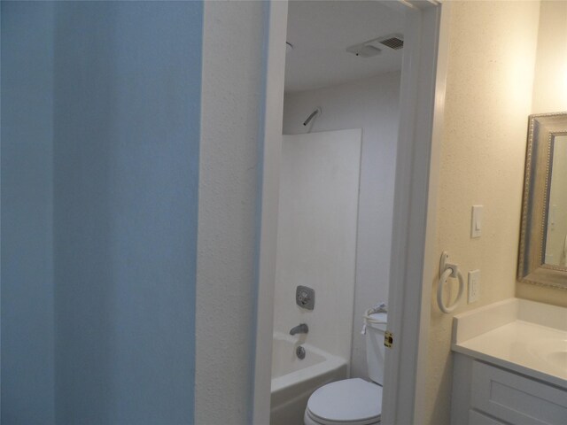 full bathroom featuring bathing tub / shower combination, vanity, and toilet