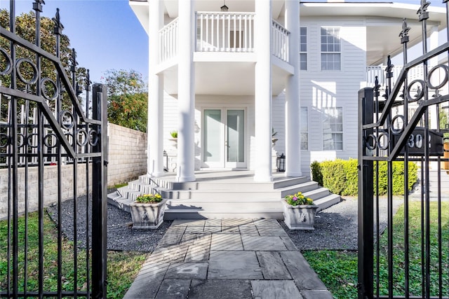 back of property with a balcony