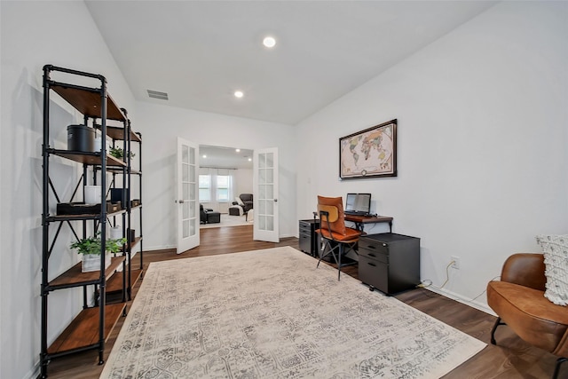 home office with french doors and dark wood-type flooring