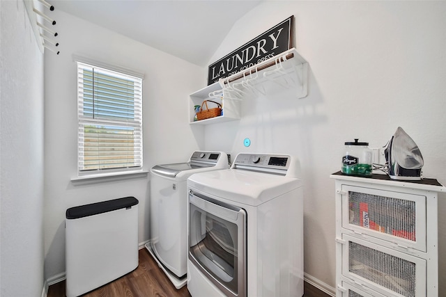 washroom with independent washer and dryer and dark wood-type flooring