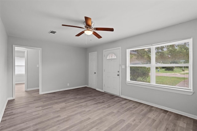 entryway with light hardwood / wood-style flooring and ceiling fan