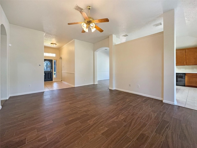 unfurnished living room featuring ceiling fan, dark hardwood / wood-style flooring, and a textured ceiling