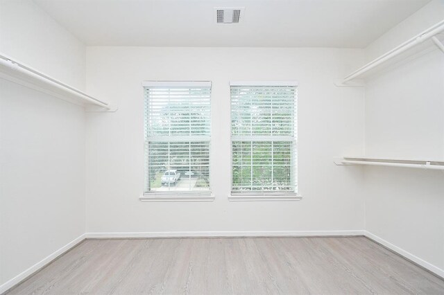 spacious closet featuring light wood-type flooring