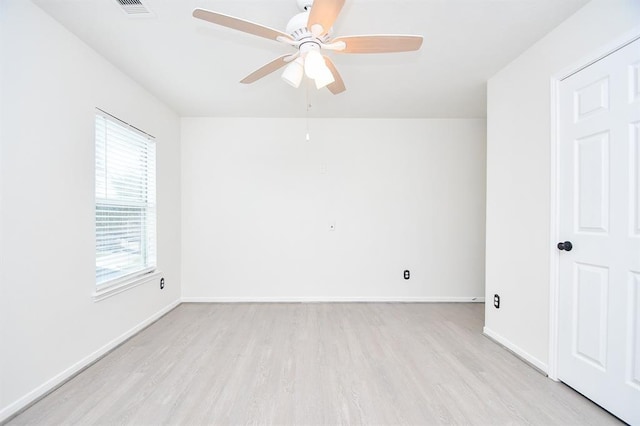 unfurnished room featuring ceiling fan and light wood-type flooring