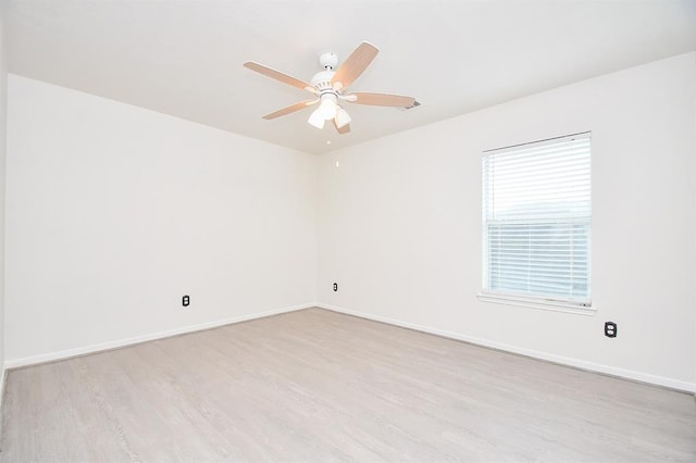 unfurnished room with ceiling fan and light hardwood / wood-style floors