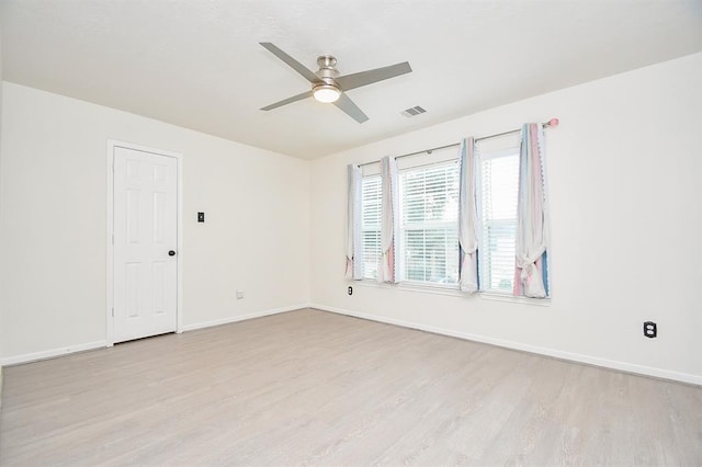 empty room featuring light hardwood / wood-style floors and ceiling fan