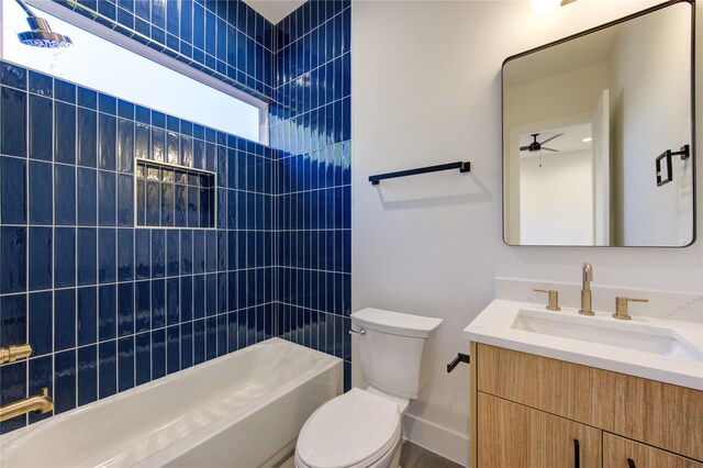 full bathroom with vanity, toilet, ceiling fan, and tub / shower combination