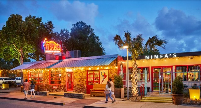 view of outdoor building at dusk