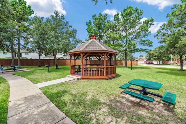 surrounding community featuring a gazebo, a yard, and a deck