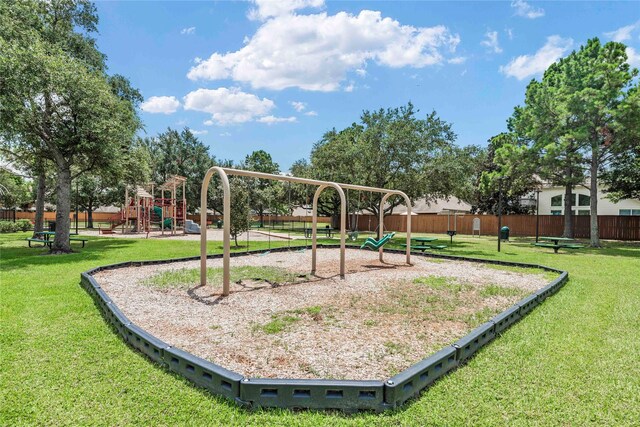 view of jungle gym featuring a lawn