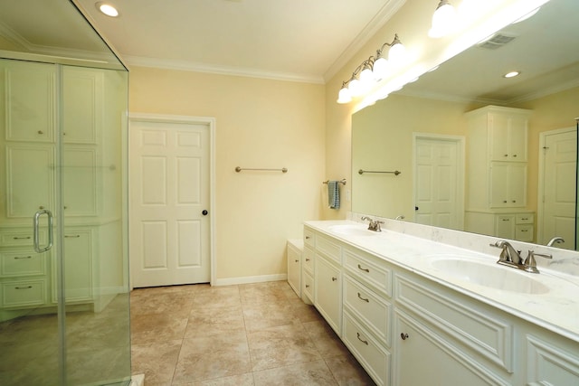 bathroom featuring vanity, tile patterned floors, and ornamental molding