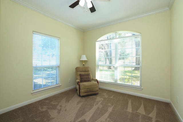 living area with carpet flooring, ceiling fan, and ornamental molding