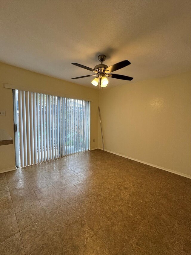 empty room featuring ceiling fan