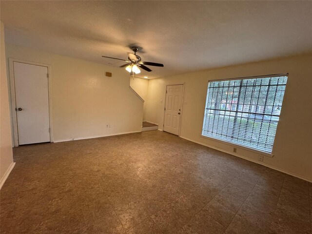 empty room featuring ceiling fan